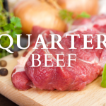 raw grass fed steak on cutting board